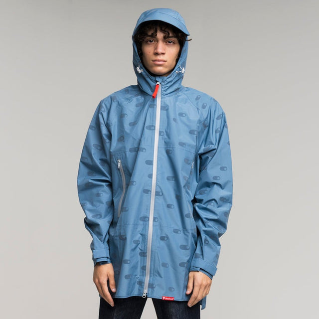 Man wearing a blue reflective raincoat