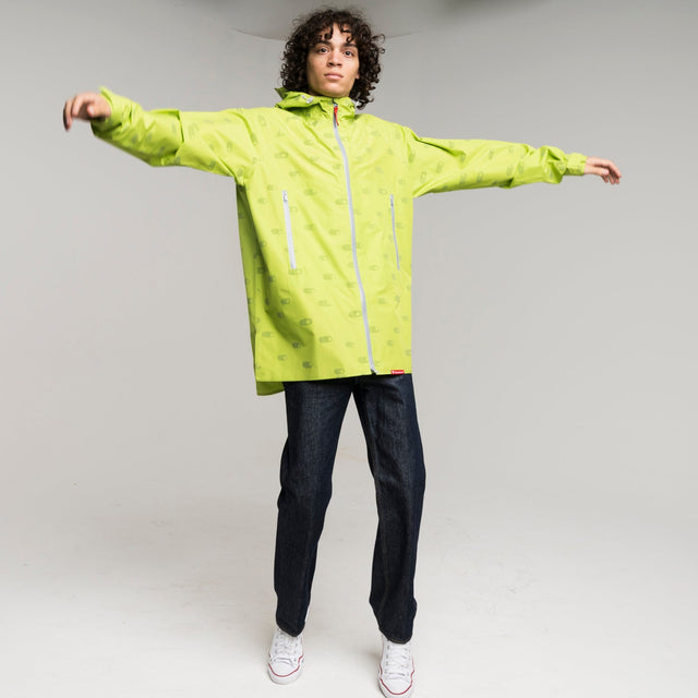 man wearing a bright green reflective raincoat