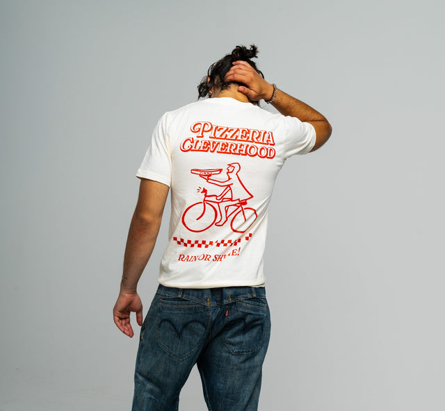 Person wearing a white t-shirt with a Cleverhood
red biking graphic